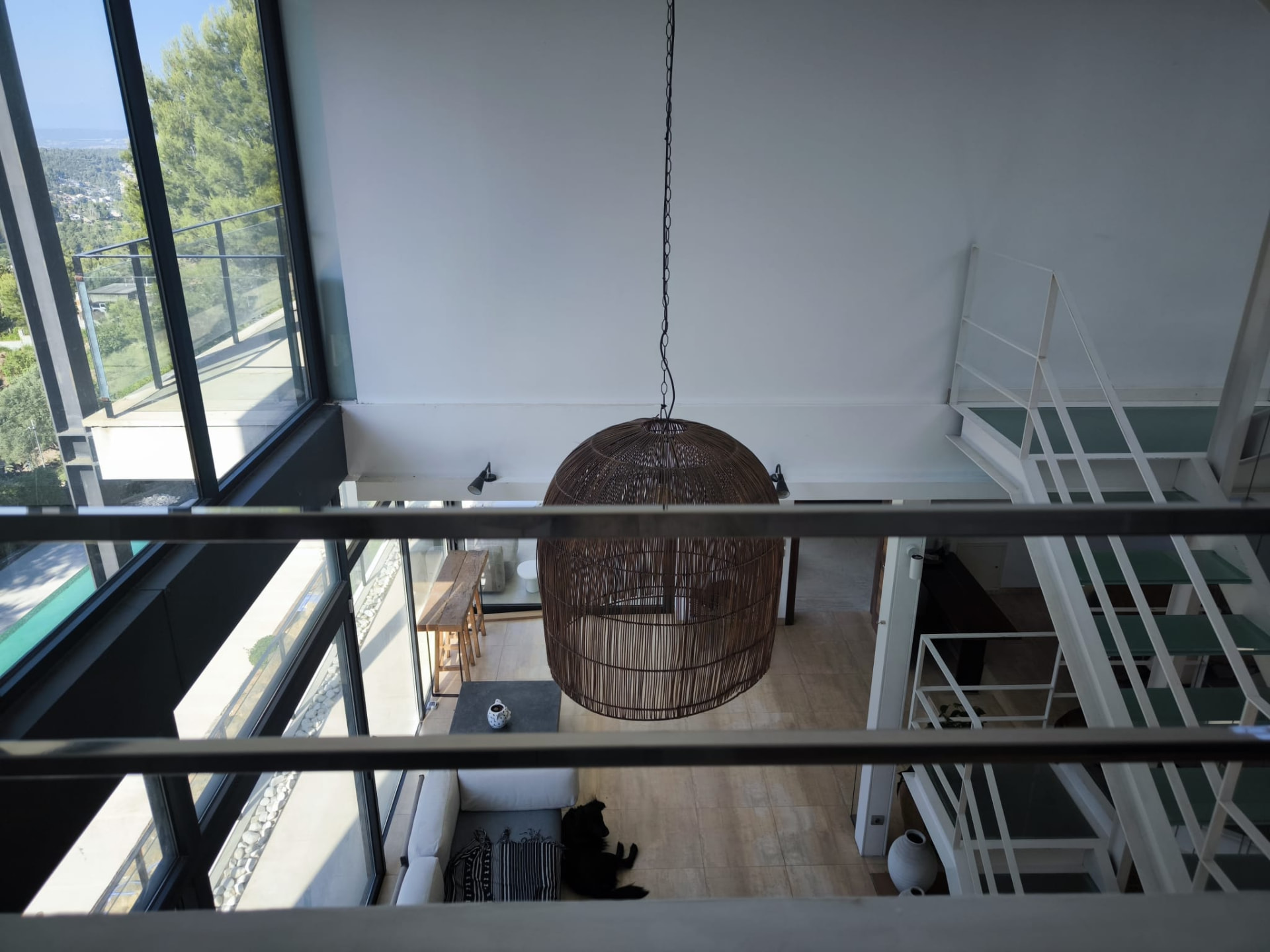 Double-height living space seen from the upper gallery