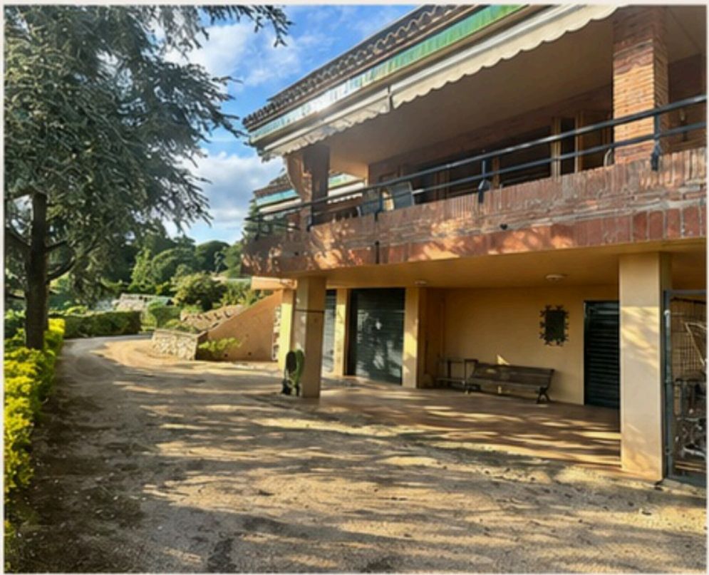 Exterior of the villa with terraces and covered parking